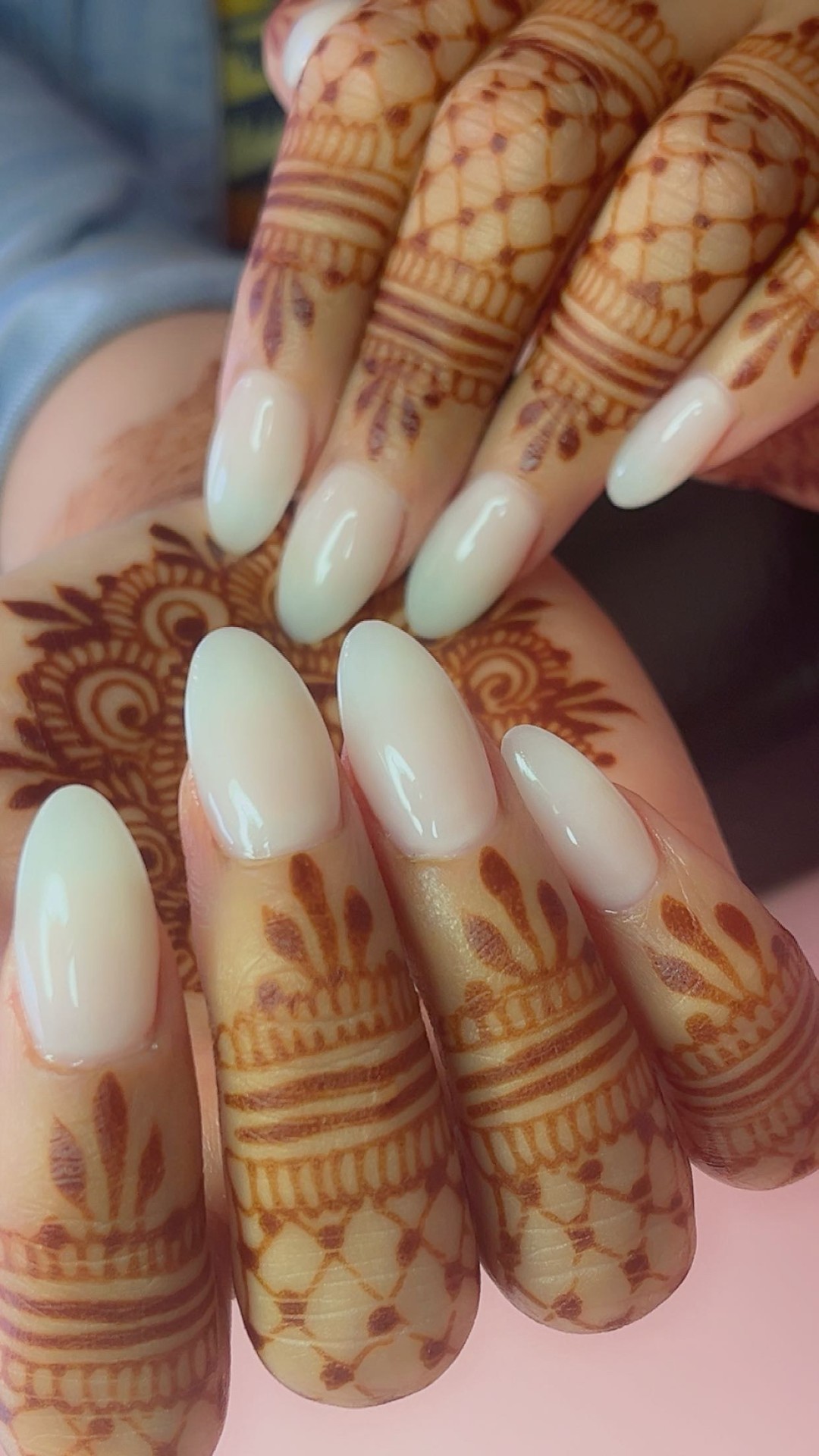 Milky white almond nails paired with henna